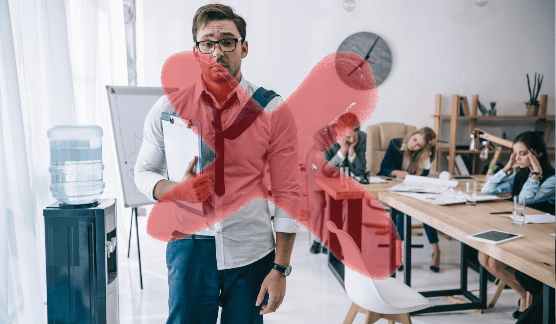 Man holding clipboard with large red X over him; colleagues sitting tired at a conference table.