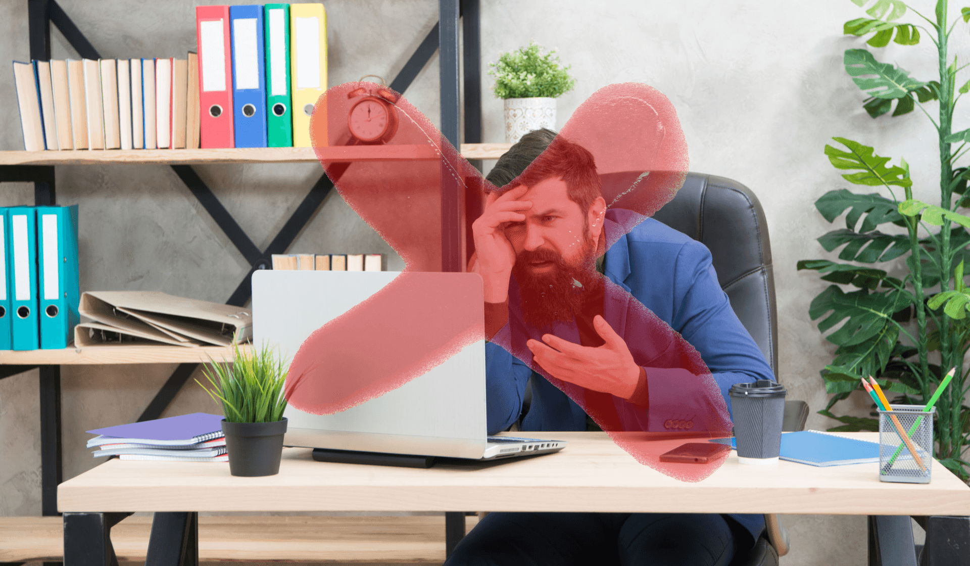 Frustrated man at desk with red X overlay, laptop open amidst office files and plants.